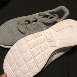 A new pair of Nike shoes size 4 kids women size 7